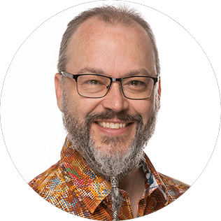 Jim Cook, music production educator and lead mentor smiling in a professional headshot.