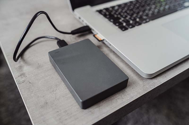 An image showing an external drive representing the importance of backing up files.