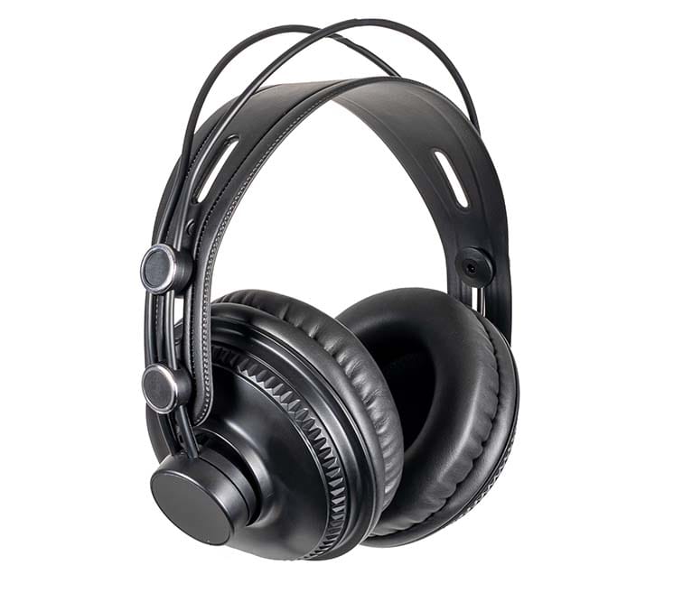 A studio product photograph of black closed-back headphones, showcasing a completely solid and sealed outer ear cup design built for acoustic isolation.