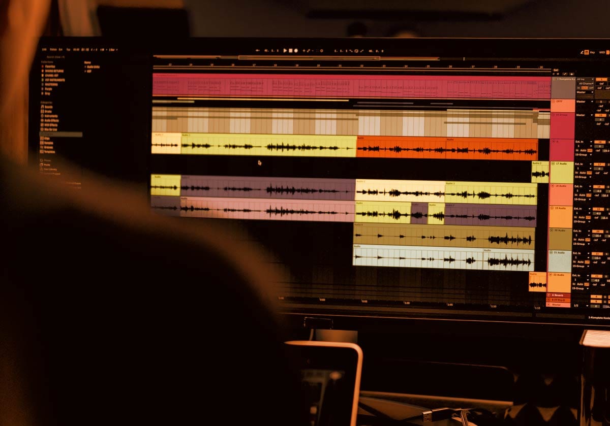 Digital Audio Workstation (DAW) software interface displayed on a computer screen in a home music studio
