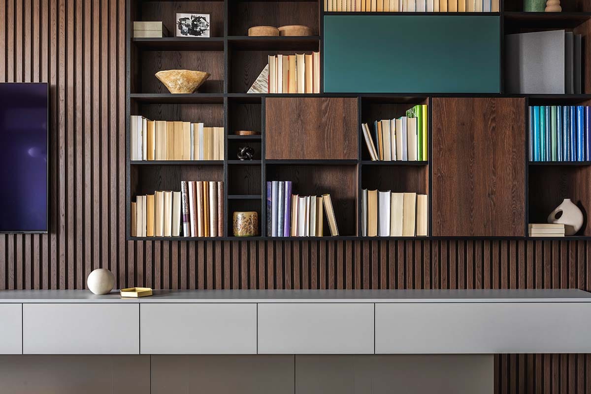 Modern wooden wall bookshelf filled with books improperly used as a DIY acoustic diffuser in a room