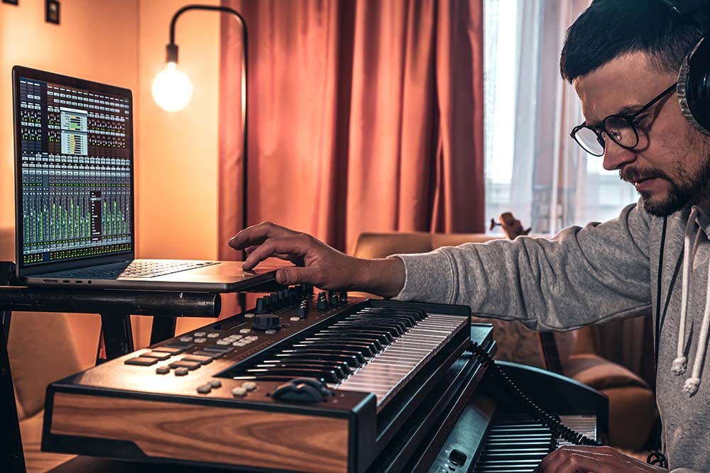 A man uses what he has learned from MIDI Madness: Tier 2 to compose more realistic MIDI music.