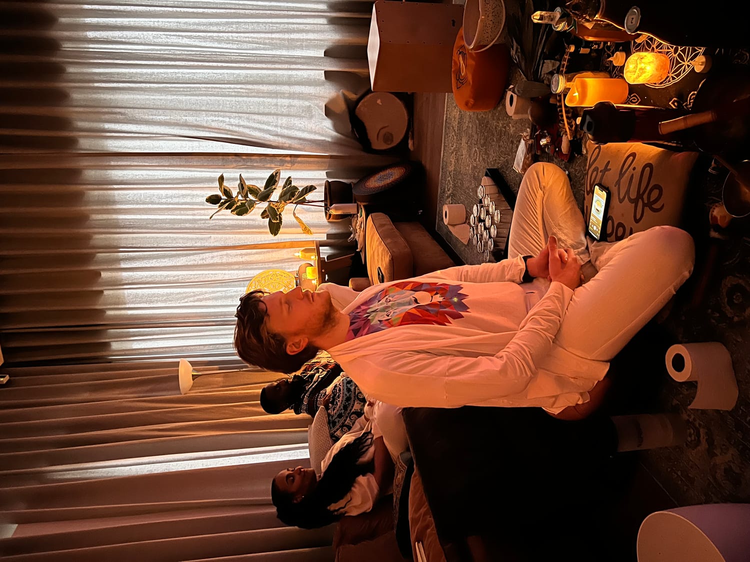 Ruben in meditation during ceremony, with facilitation assistants present