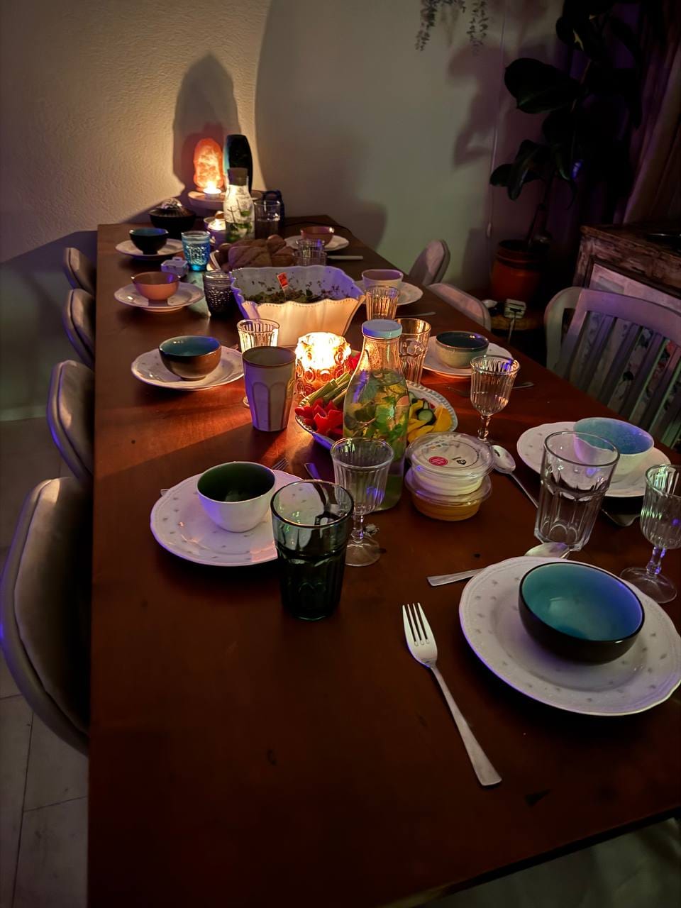 A shared meal at the retreat, candlelit table