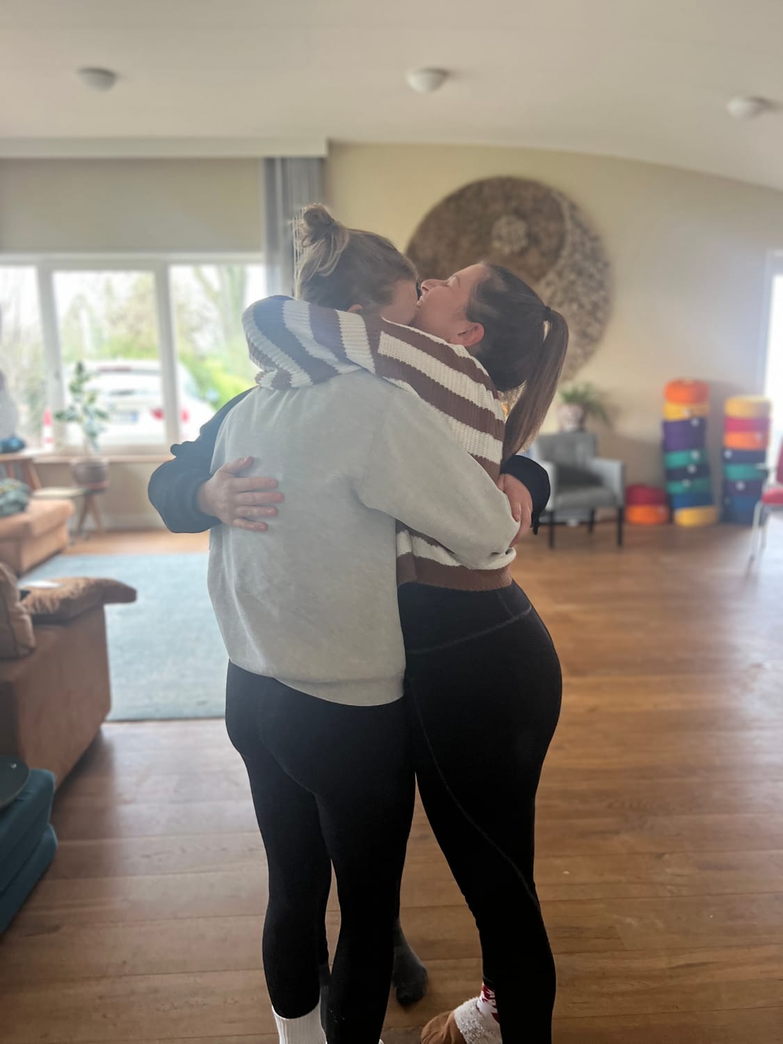Two participants embracing warmly