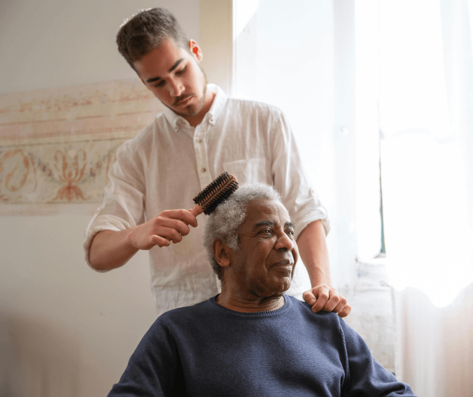 built by caregivers gen x caregiver son pushing his dad in a wheelchair