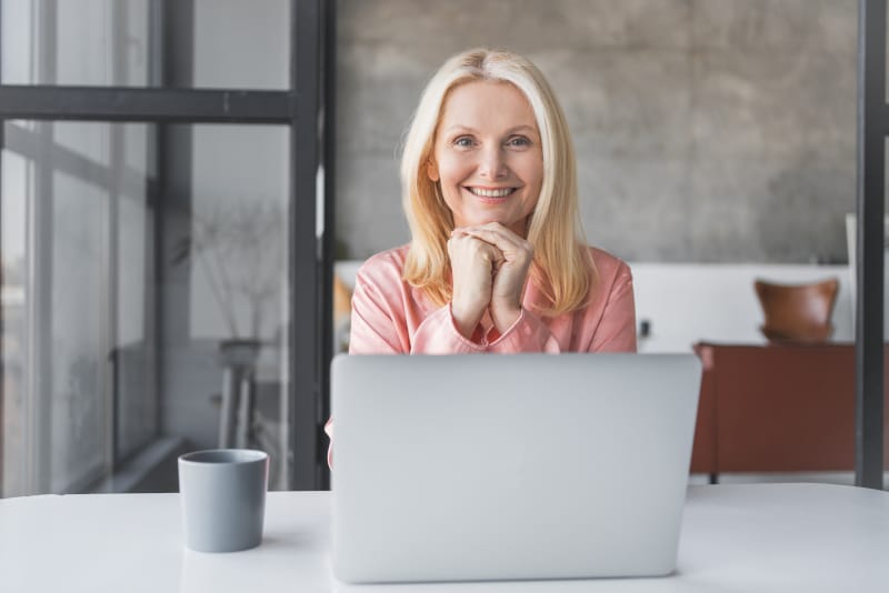 Woman smiling at her desk