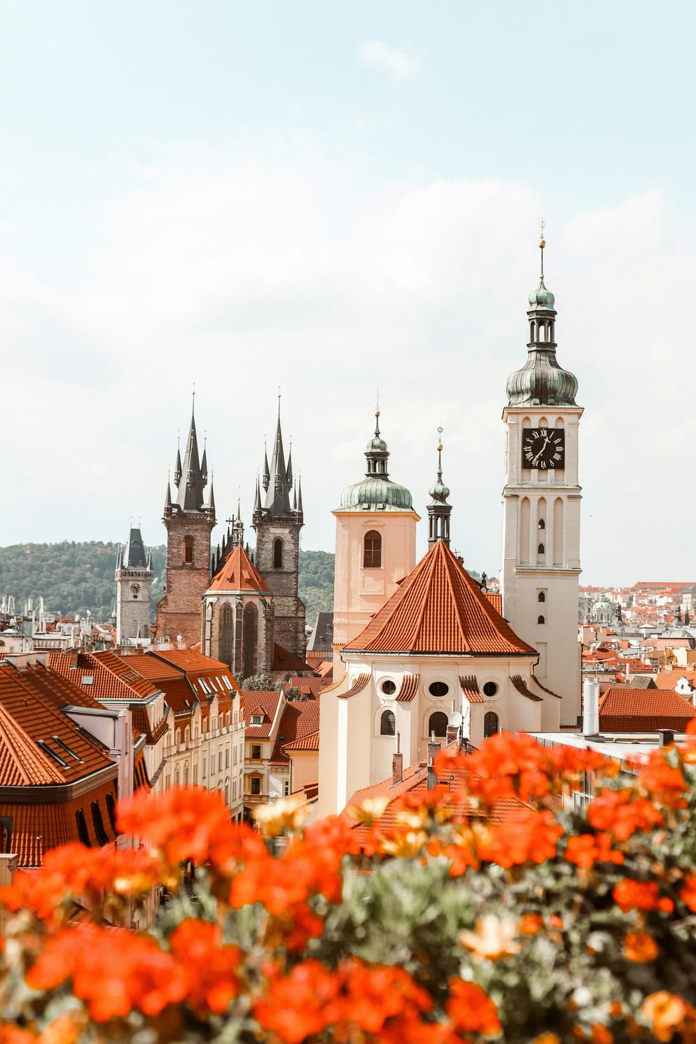alt="A picturesque view of the historic city center of Prague, Czech Republic, showcasing the spires of the Church of Our Lady before Týn, located in Old Town Square"
