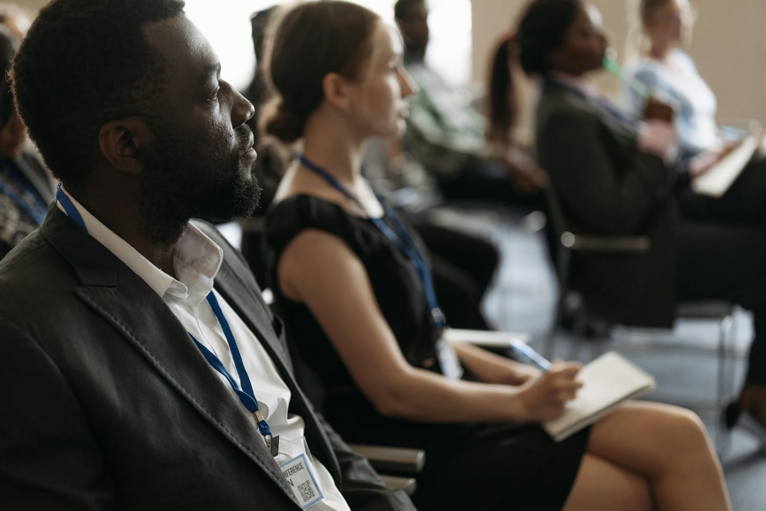A close up of conference attendees