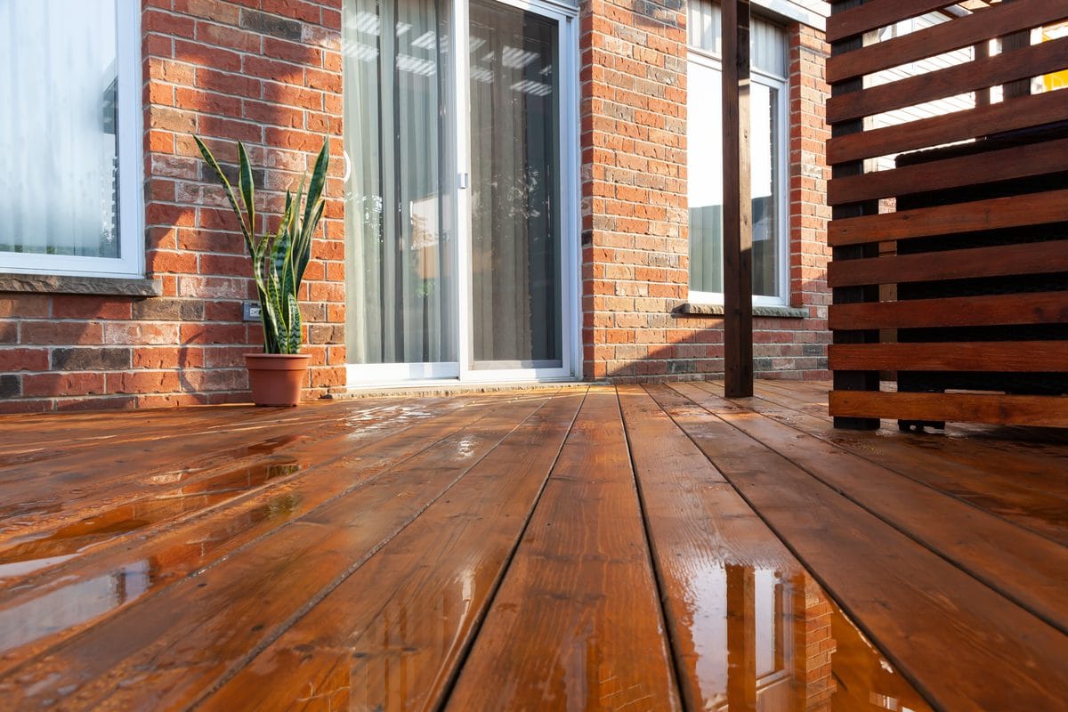A stained wooden backyard deck