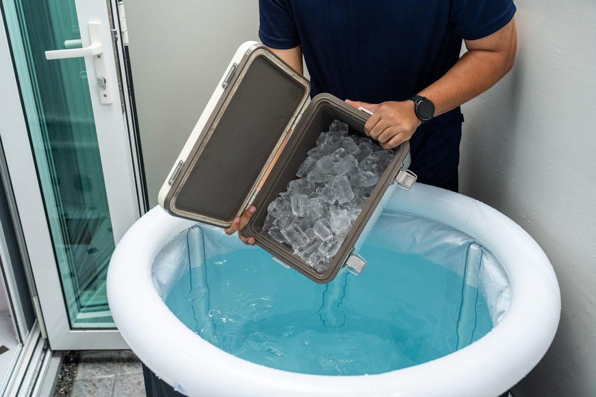 Ice being poured into an inflatable tub