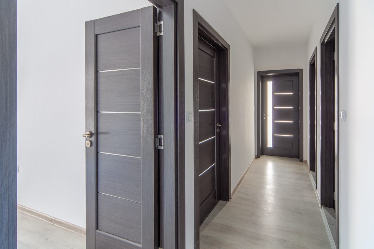 A hallway lined with interior doors