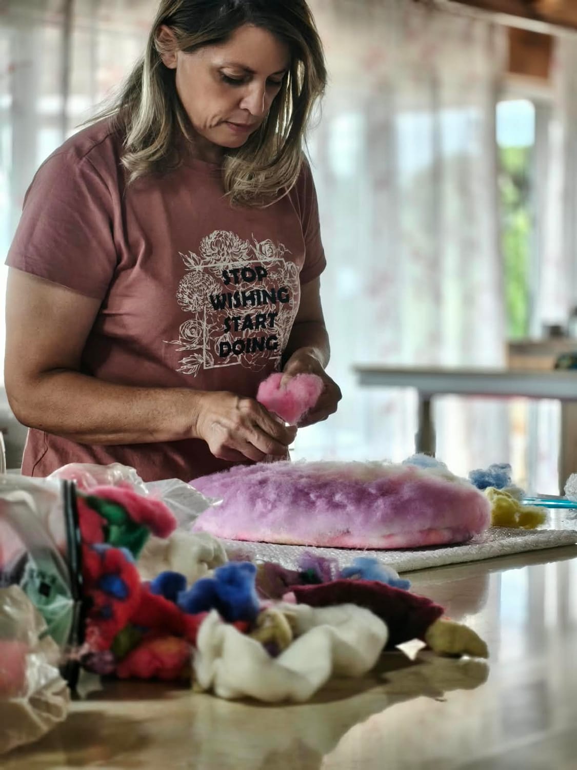 female artisan in warm wool workshop portrait