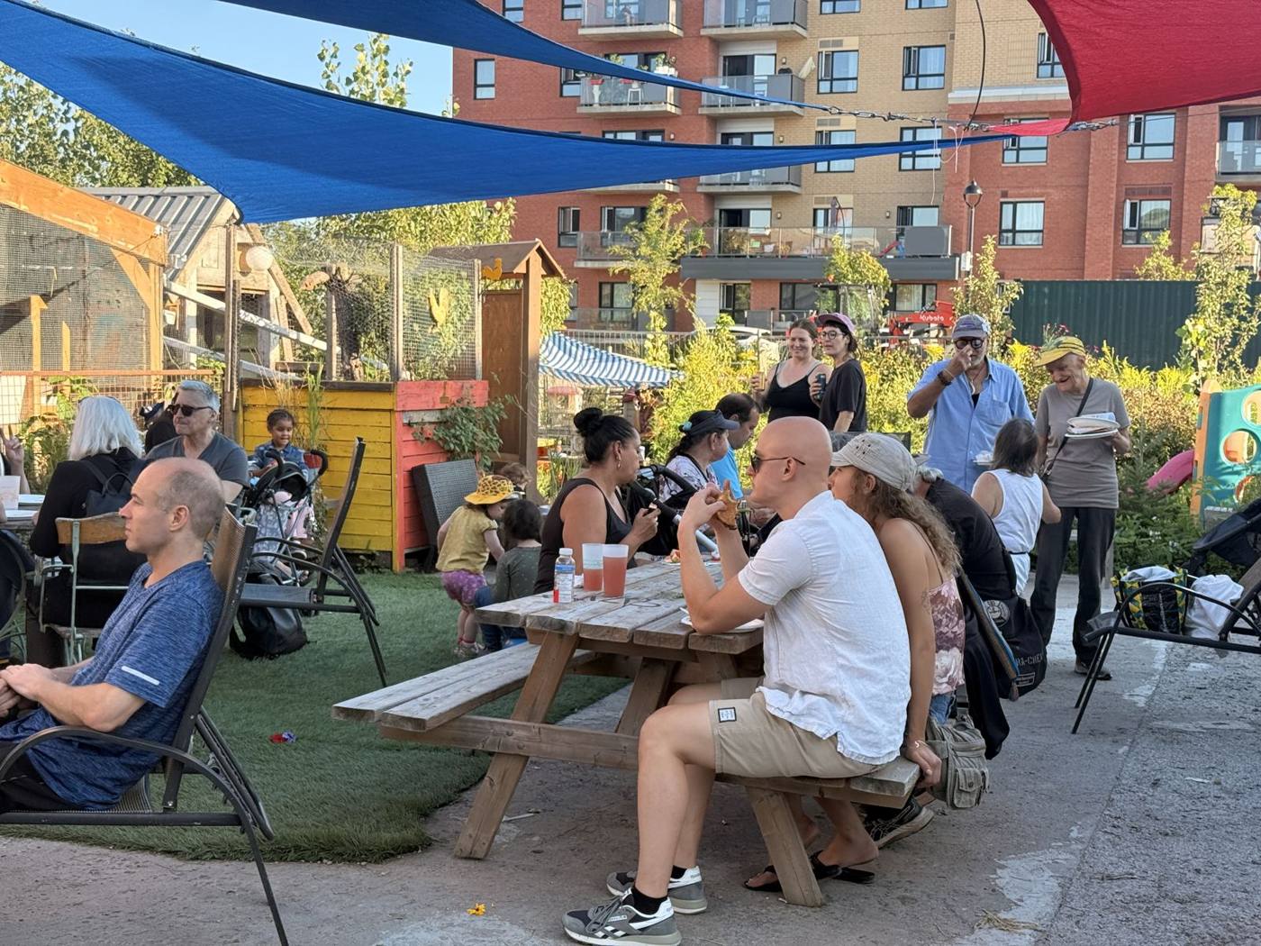 A party in La Fermette’s courtyard under the shade sails