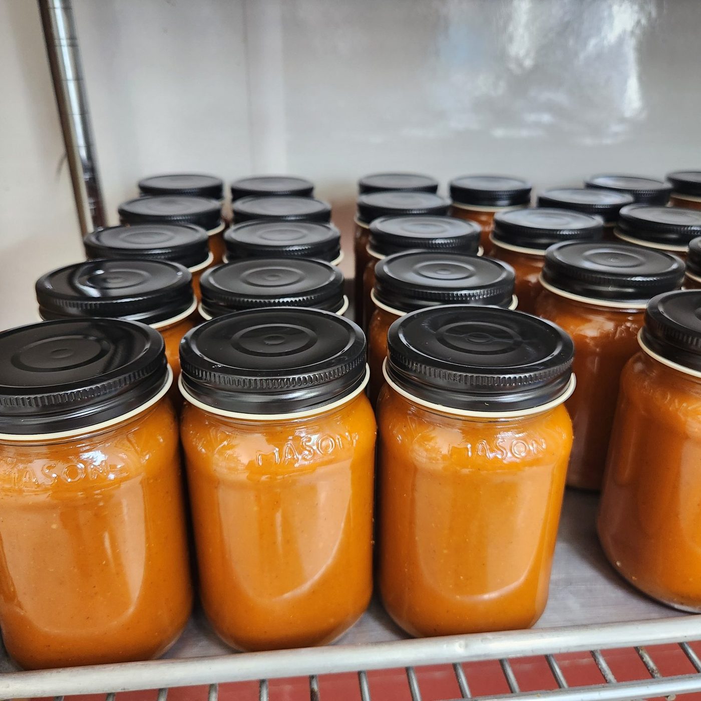 Jars of tomato sauce made in the kitchen