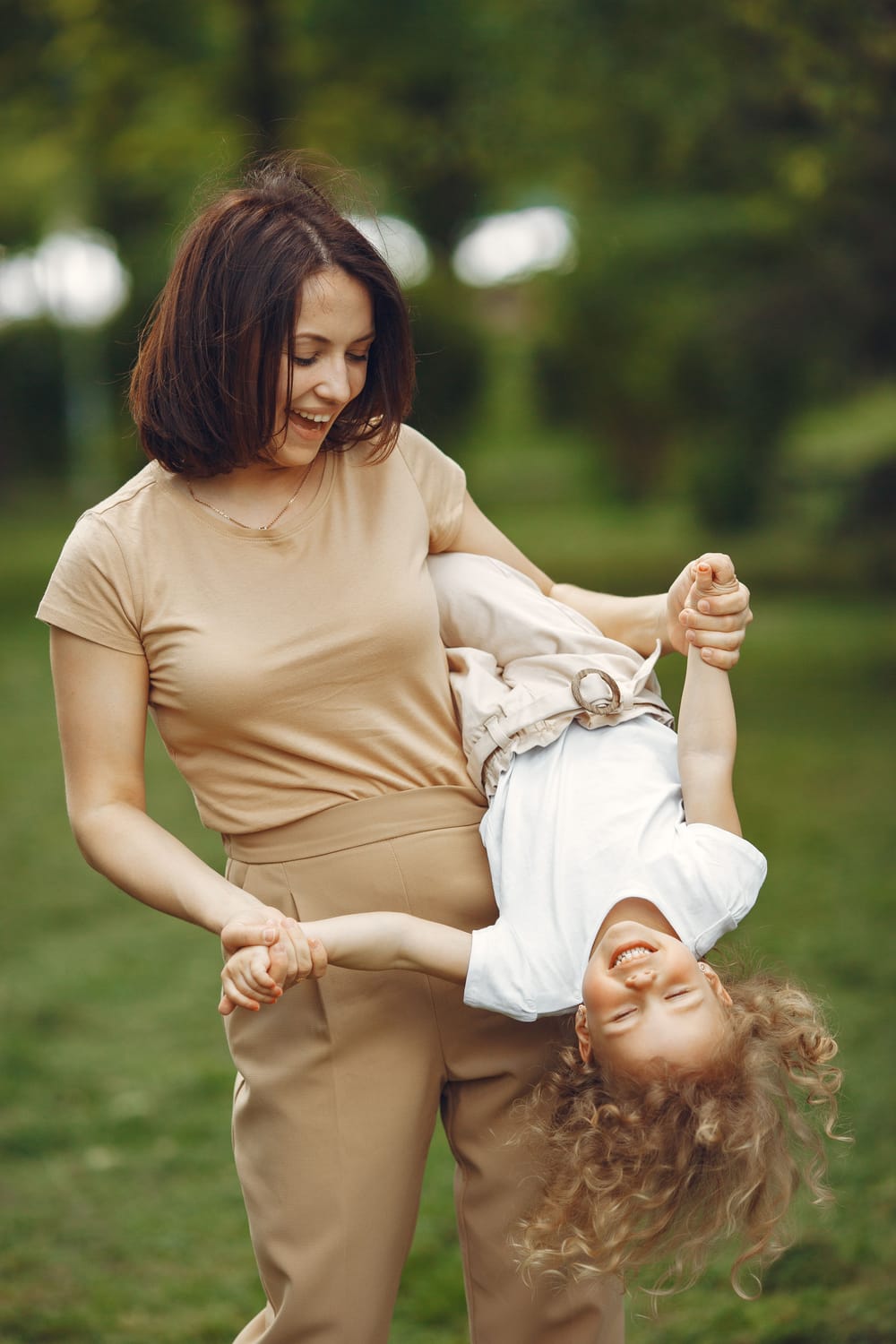 happy mom playing with her kid