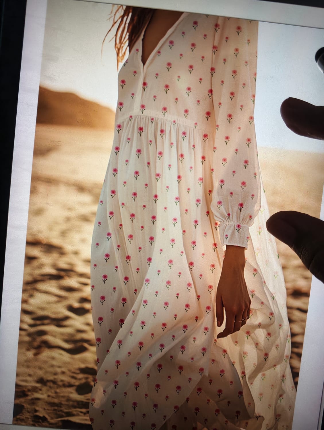 Annelya is viewing her Daisy Joy surface pattern design collection on a dress mockup