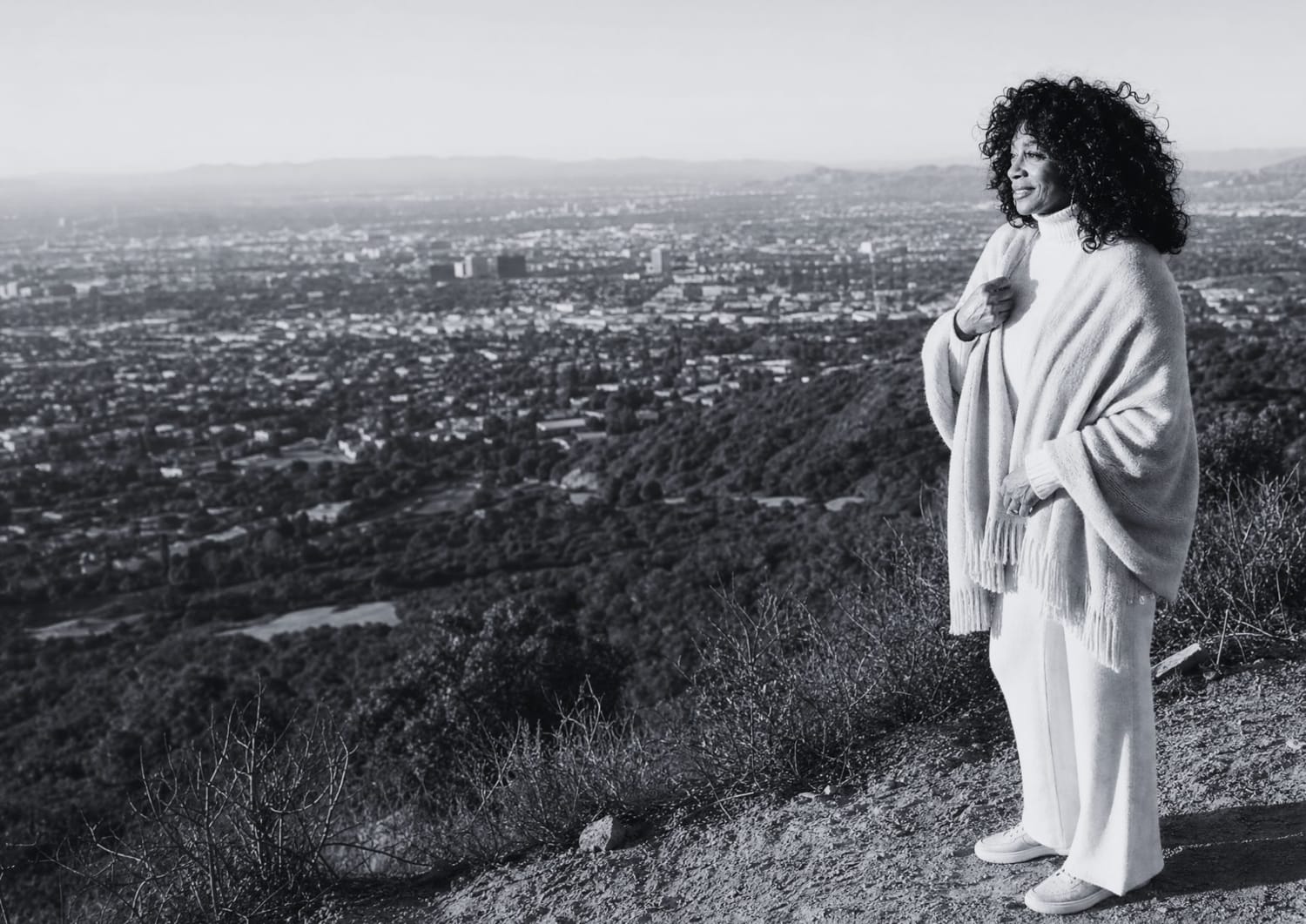 Ranise Gillespie standing at an overlook above the city