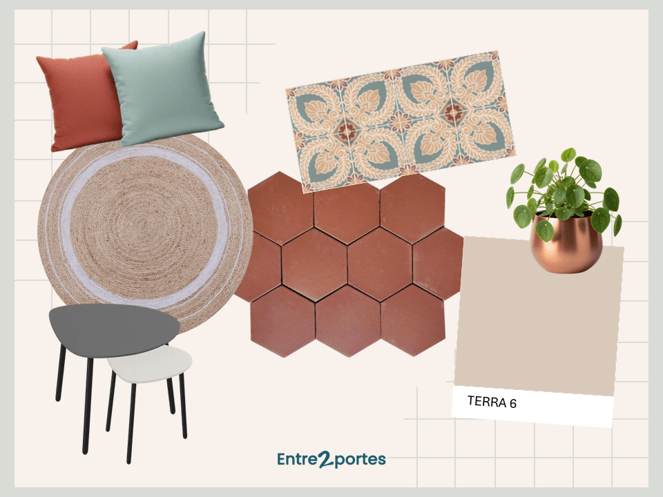 Salon avec tomettes, canapé blanc, coussins rouge et bleu gris, tapis rond