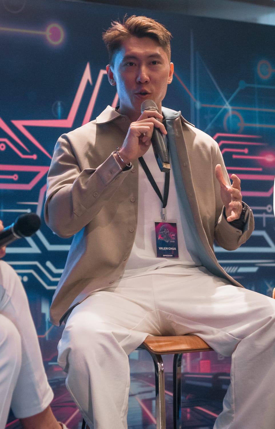 Valen speaking on stage