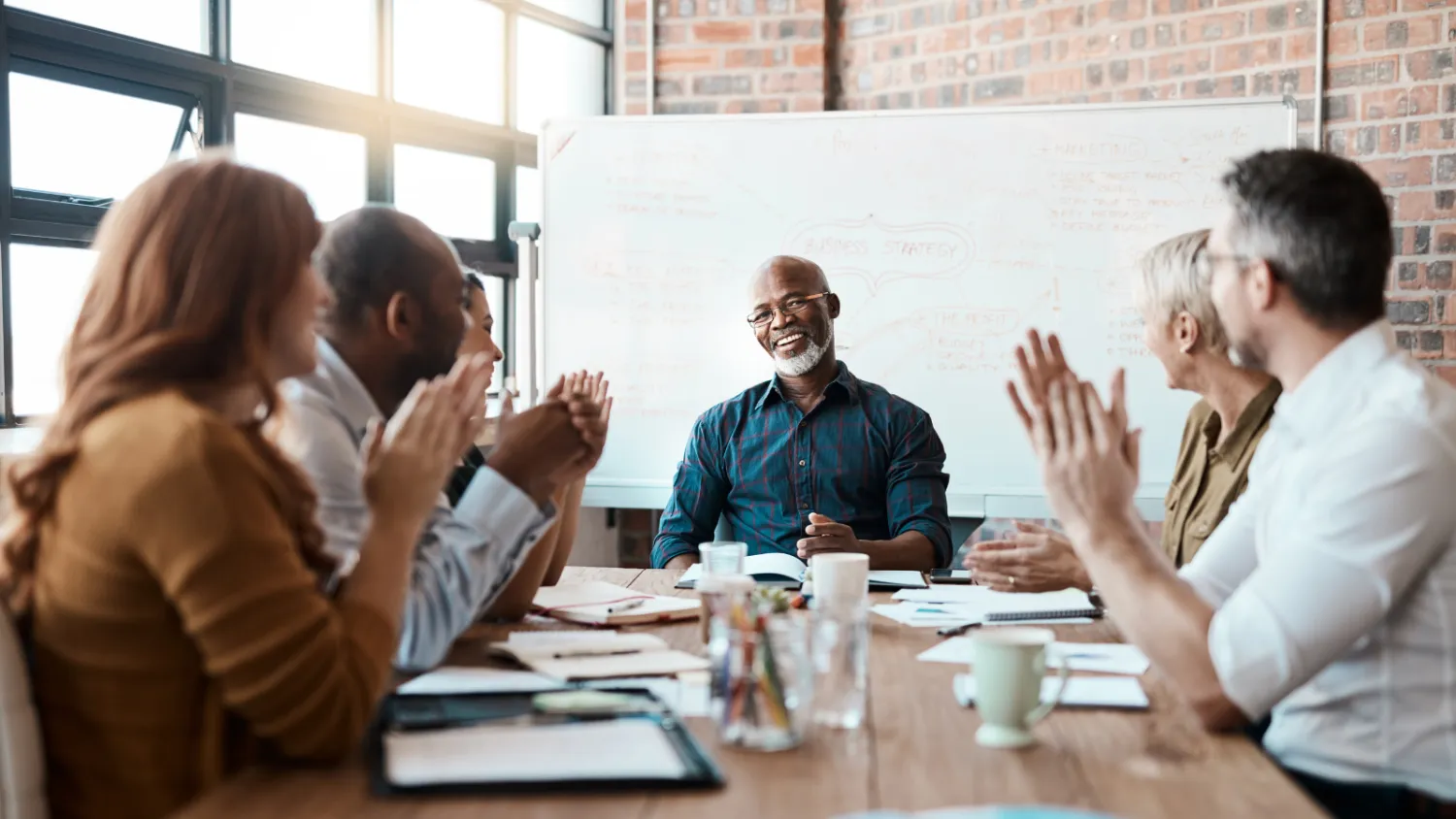 Leaders giving feedback around a table