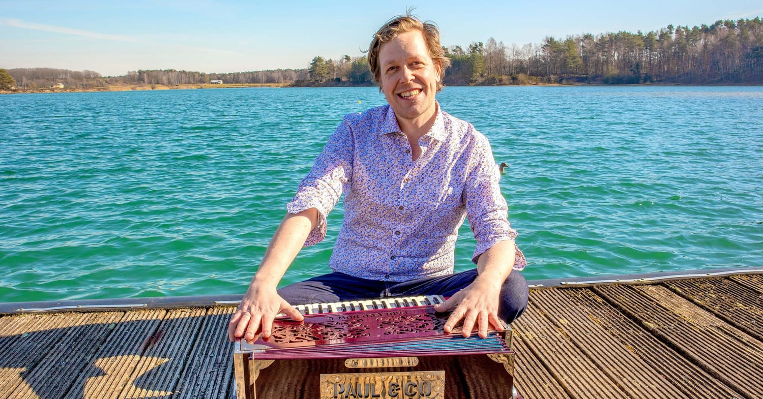 Kenny at the harmonium
