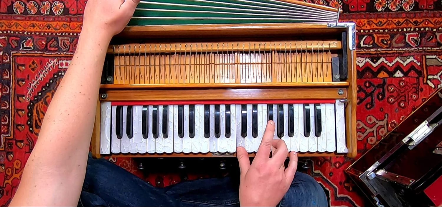 Hands playing harmonium
