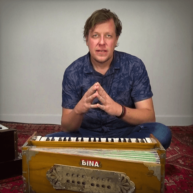 Kenny Clarys behind the harmonium