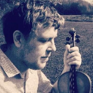 Kenny Clarys holding violin