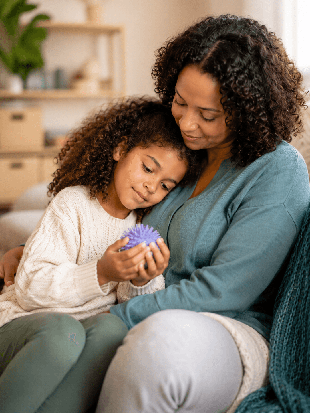 A mother and daughter sharing a tender, connected moment