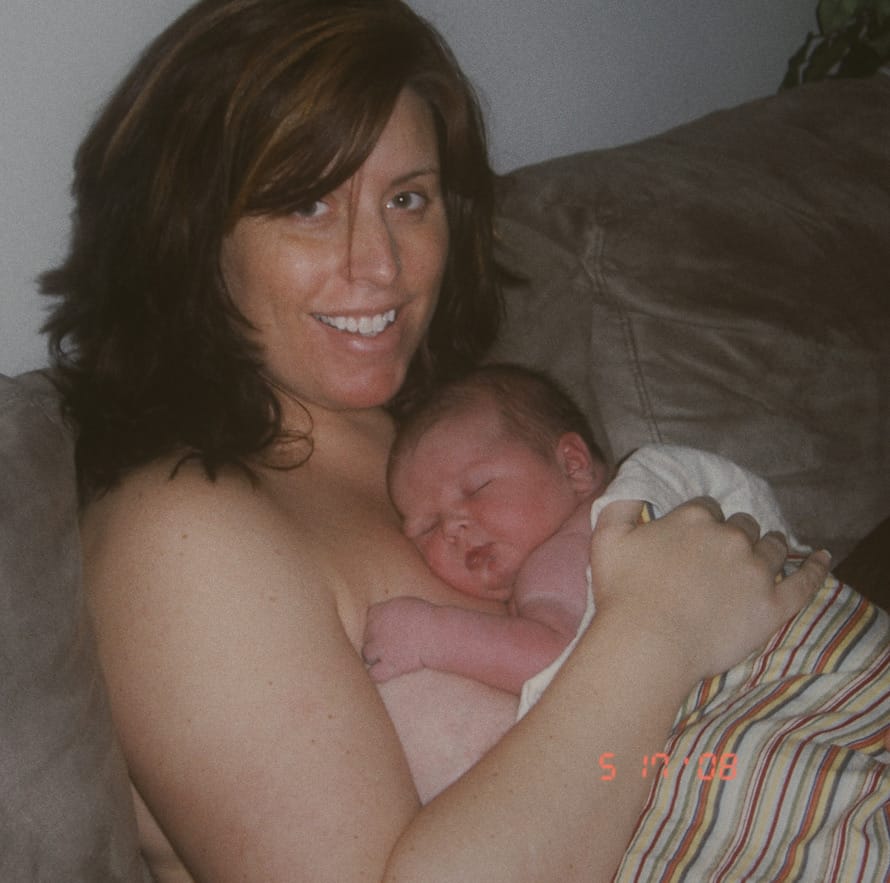 Danalise holding her 13-pound newborn son 1 hour after an unassisted homebirth