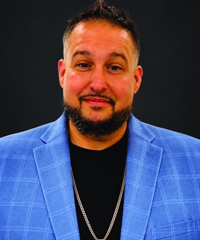 Author Randi Rodriguez wearing a blue jacket