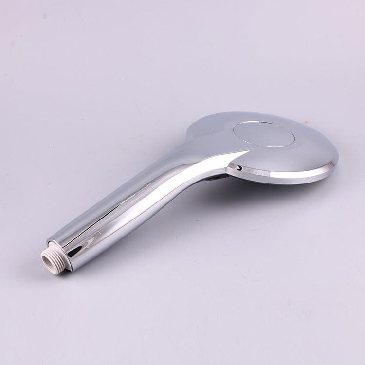 Hand holding the colour-changing shower head in use