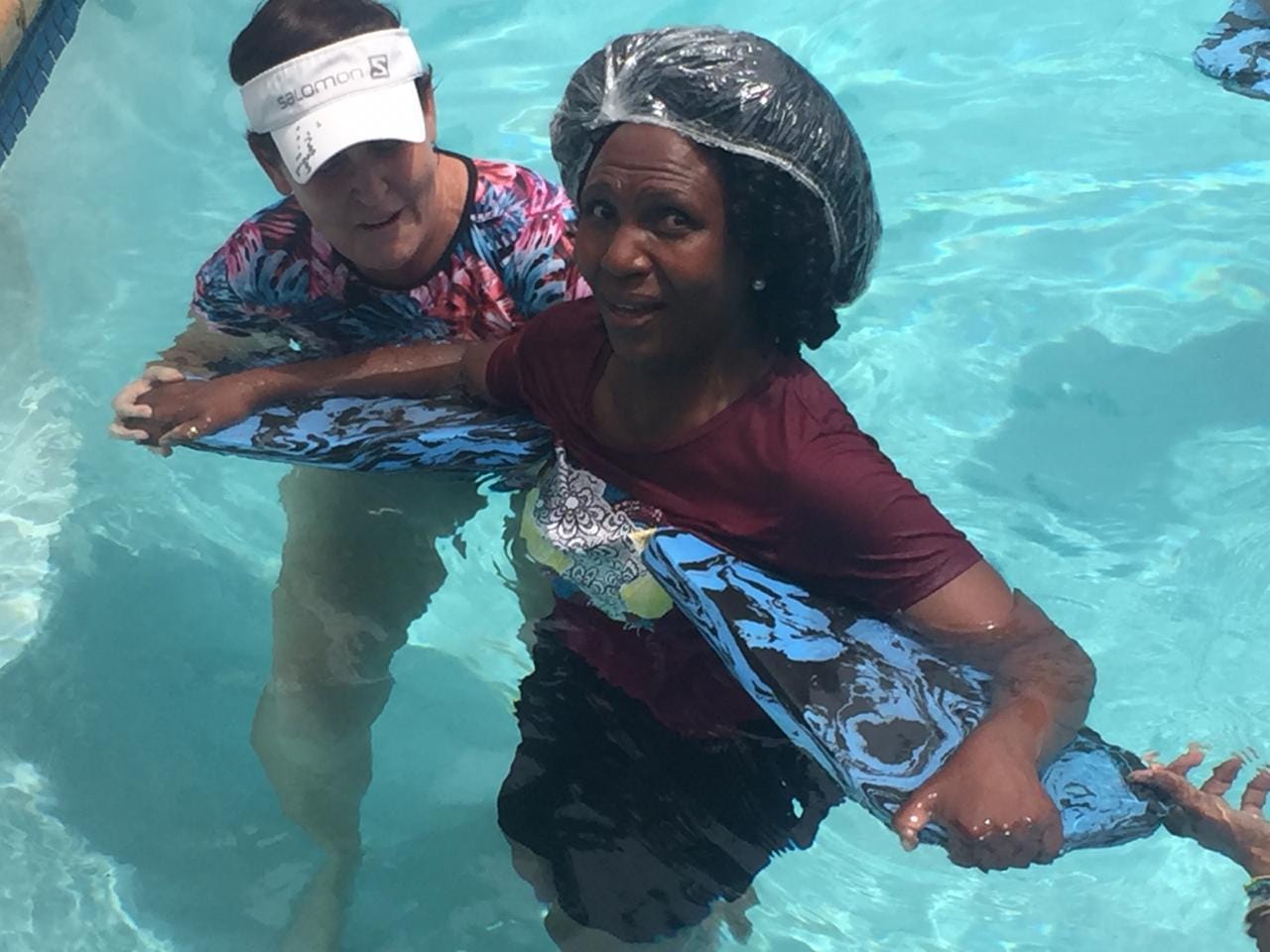 Gail teaching an adult swimmer