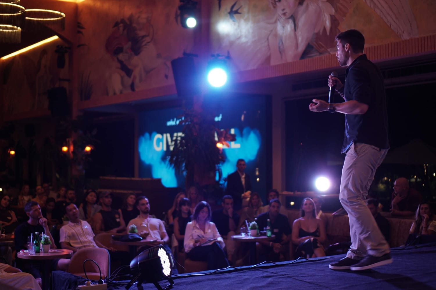 François de Neuville speaking on stage