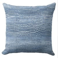 A blue throw coastal throw pillow featuring an ocean waves block print