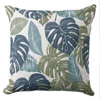 A palm leaf coastal throw pillow featuring a botanical pattern in muted blues and green