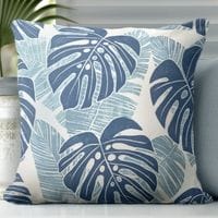 a blue and white tropical leaves throw pillow featuring an monstera leaves