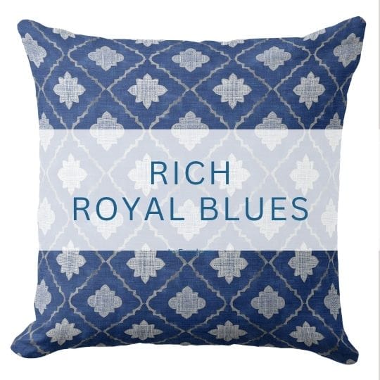 A royal blue throw pillow in a coastal style.