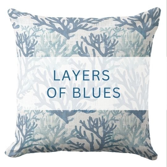 A blue in white throw pillow in a beach coastal style.