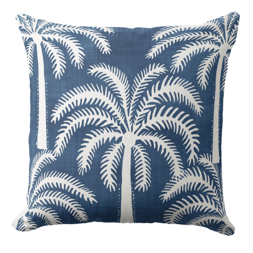 A palm tree throw pillow in dark blue and white in coastal stylecolor