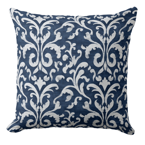 a decorative blue throw pillow featuring a Hamptons style ornate pattern in indigo blue and white.