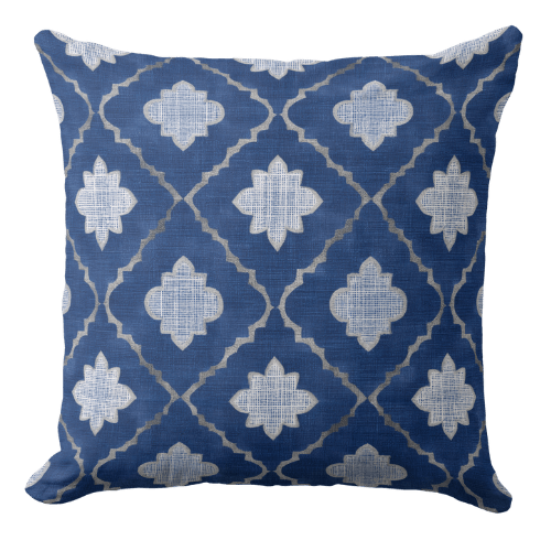 A decorative blue throw pillow with a diamond grid pattern in royal blue and off white.
