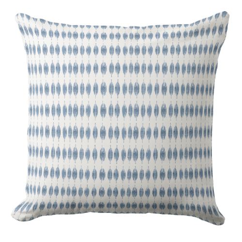 A palm tree throw pillow in dark blue and white in coastal stylecolor