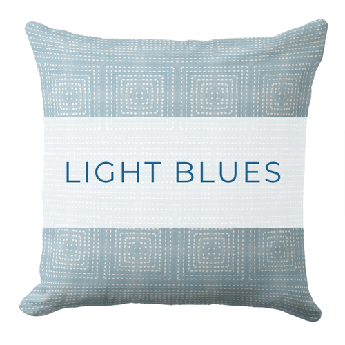 A dark blue throw pillow in a coastal style.