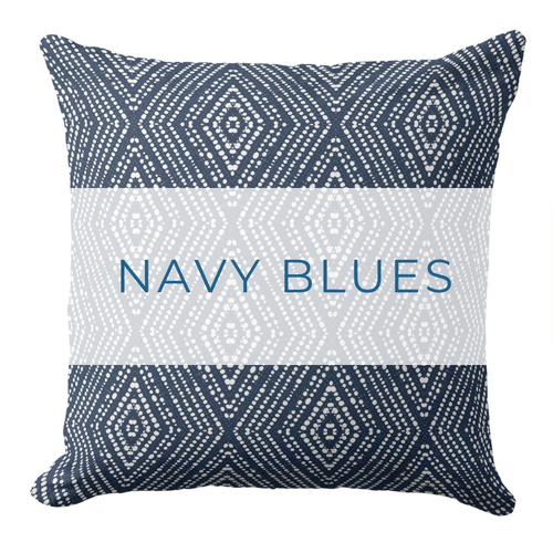 A blue and white throw pillow in a modern coastal style.