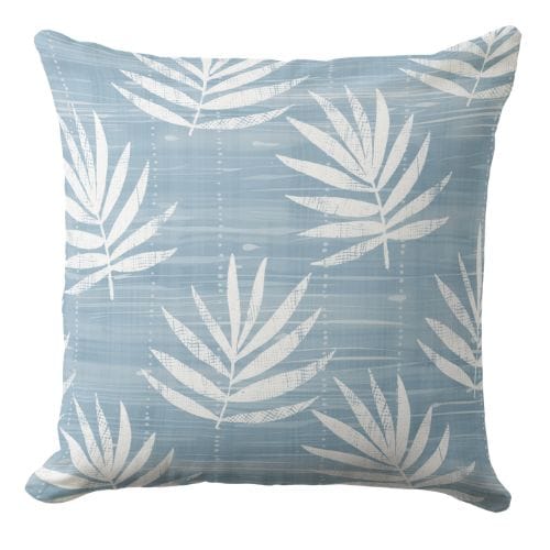 A dark blue throw pillow in a coastal style.