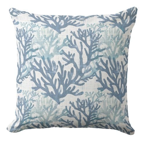 A sea coral beach throw pillow muted blues and white in an elegant coastal style