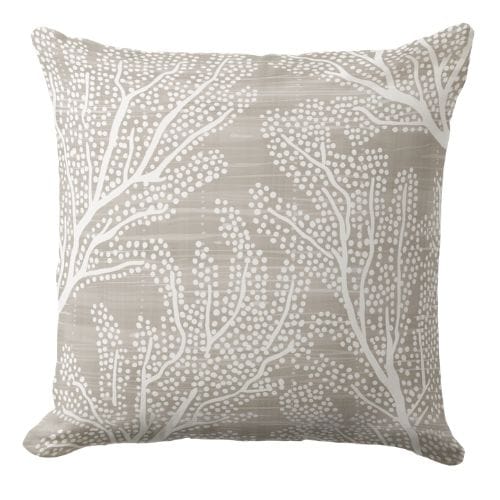 a decorative blue throw pillow featuring a Hamptons style ornate pattern in indigo blue and white.