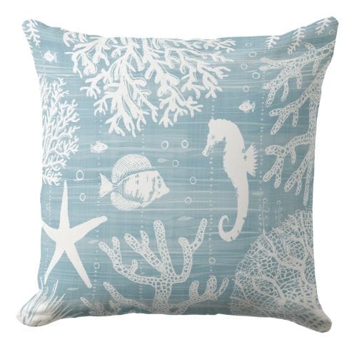 A dark blue throw pillow in a coastal style.
